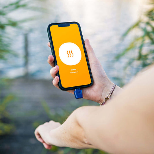 person applying heat it treatment to arm | heat it | Mosquito bite relief